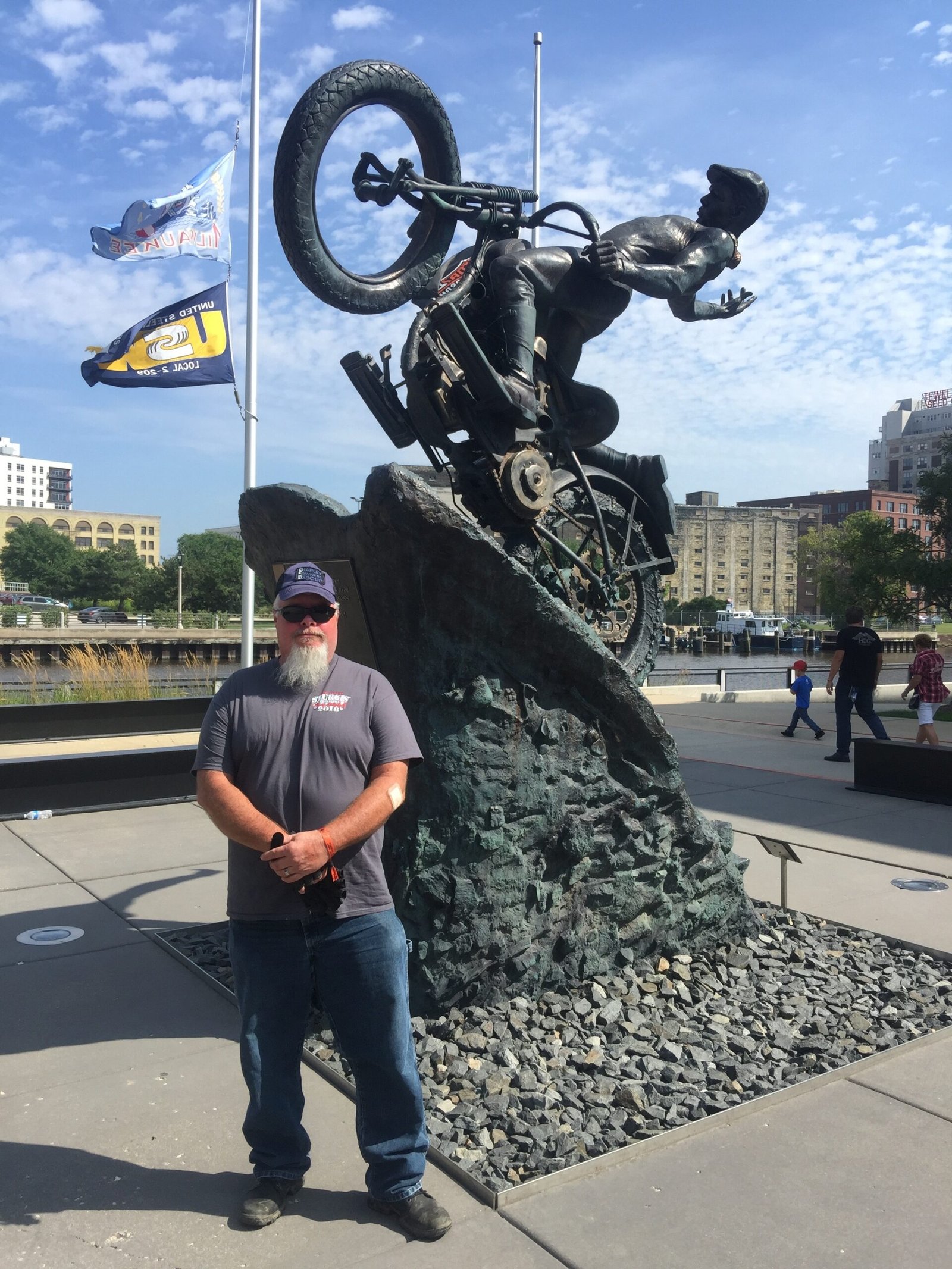 image of Mike Kimler at the statue on the HD museum Grounds